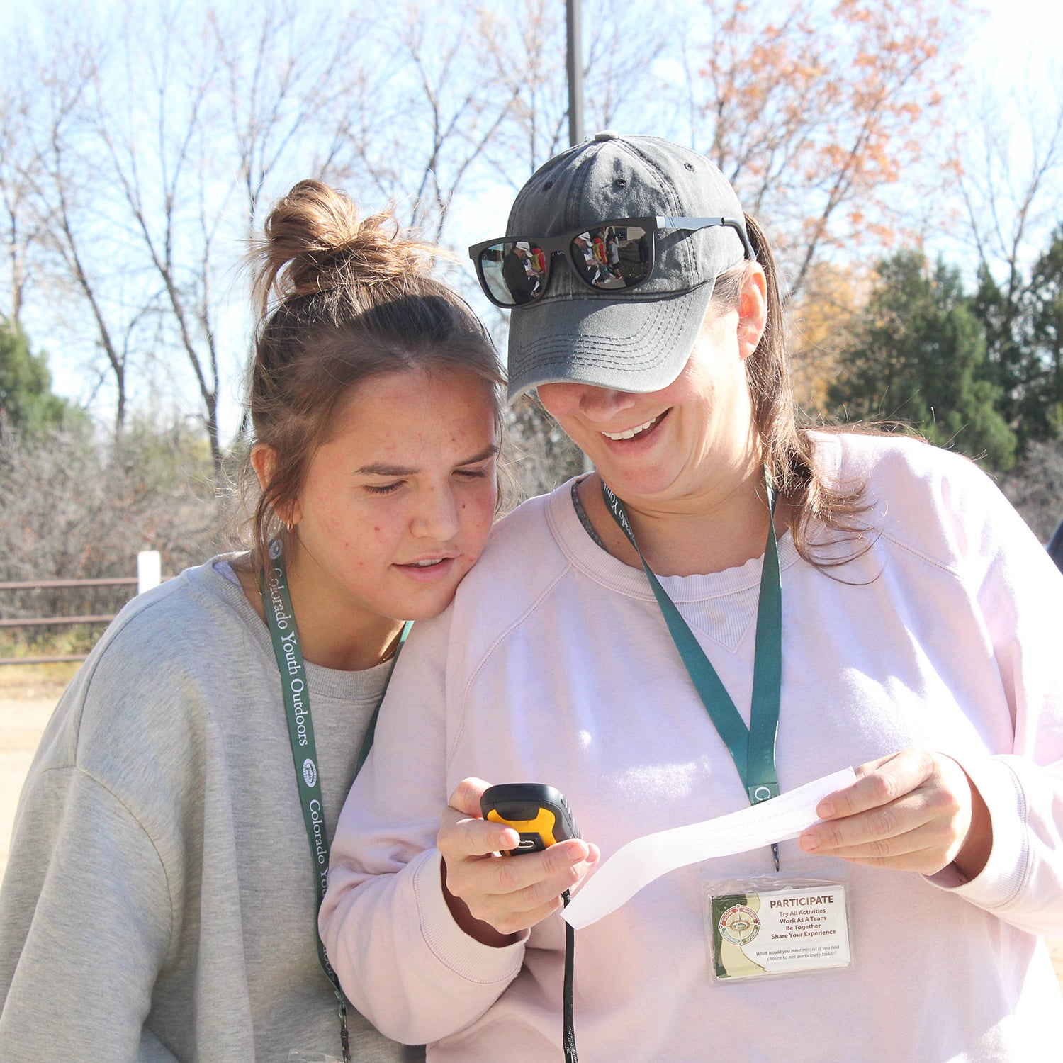 mother and daughter reading GPS device